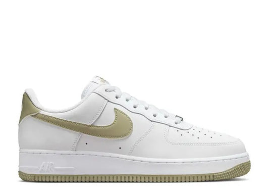 White Nike Air Force 1 07 sneakers with olive green swoosh and outsole.