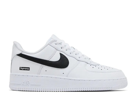 White Nike Air Force 1 Low Supreme Box Logo sneaker with black swoosh.