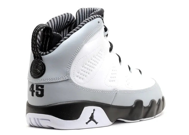 Jordan 9 Retro Pre-School White Black Wolf Grey sneakers, showing number 45 on heel & Jumpman logo.