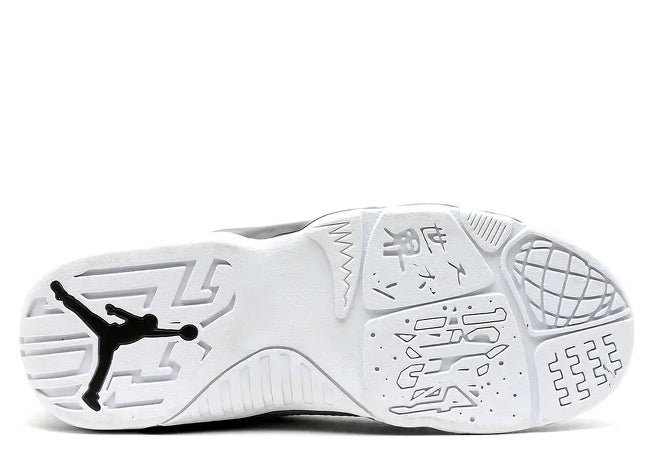 Jordan 9 Retro Pre-School white outsole with black Jumpman logo & global-themed traction.