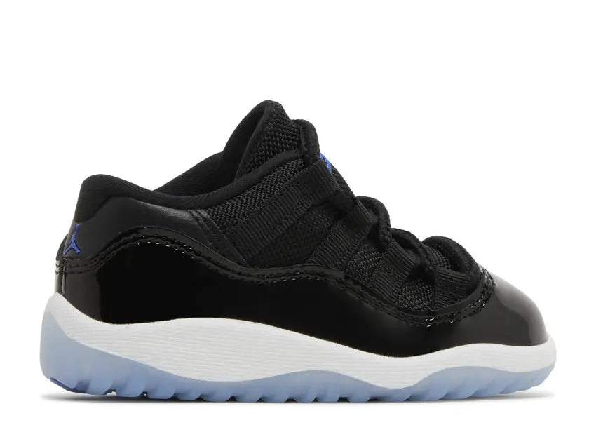 Toddler Jordan 11 Retro Low: black patent, mesh upper, white midsole, icy blue sole, royal blue logo.