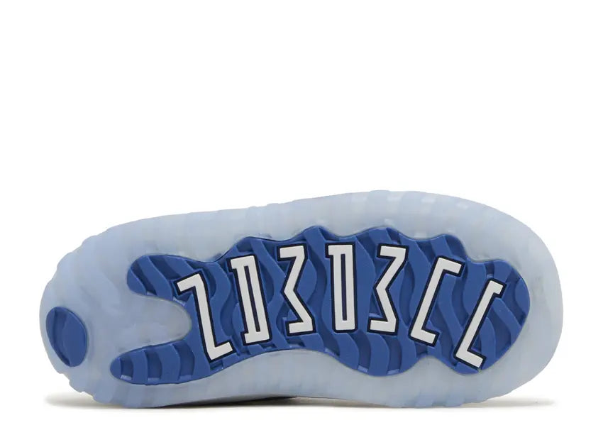 Jordan 11 Retro Low Toddler shoe sole. Translucent ice blue outsole with royal blue waves and white 23 branding.
