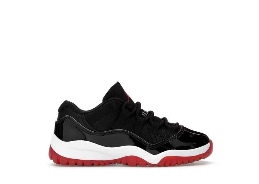 Air Jordan 11 Retro Low Bred PS black and red preschool sneaker.