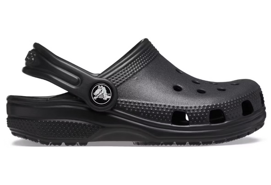 Black Crocs Boys Classic Clog, side view, with adjustable strap and logo.