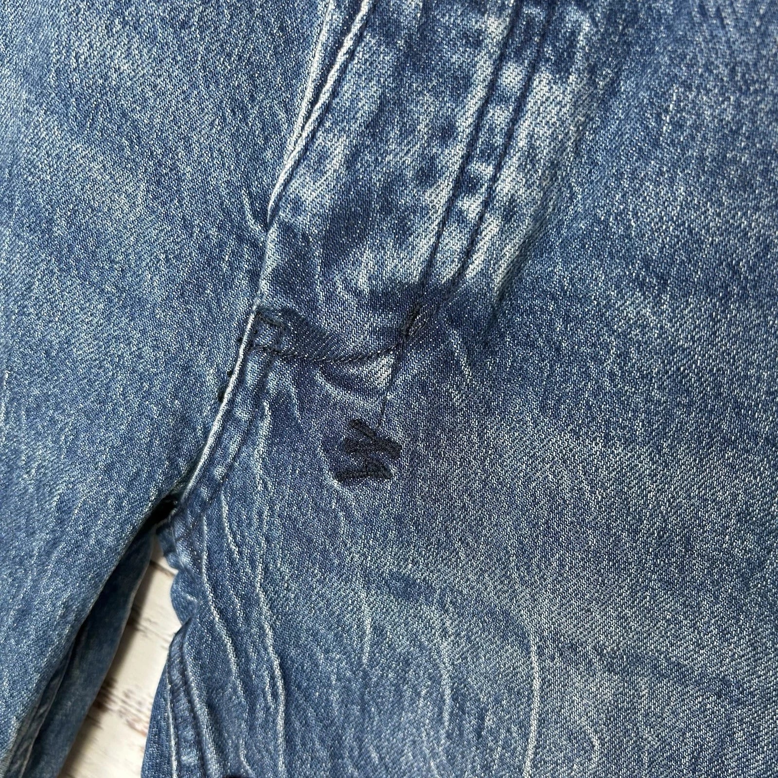 Ksubi blue denim close-up with embroidered logo, ideal for casual everyday comfort.