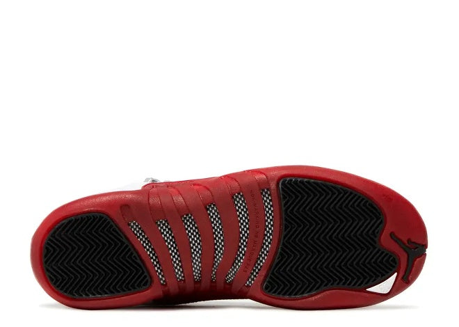 Air Jordan 12 Boys Varsity Red & Black sneaker outsole with Jumpman logo.