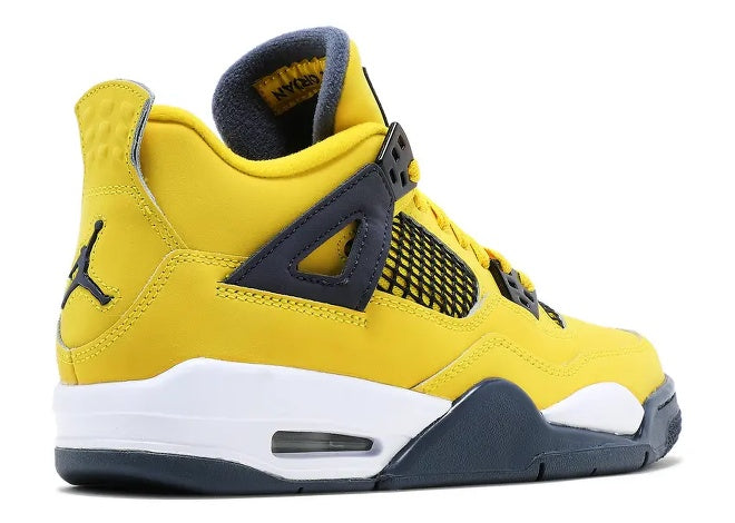 Boys Air Jordan 4 Tour Yellow Dark Blue Grey sneaker with Jumpman logo, side view.