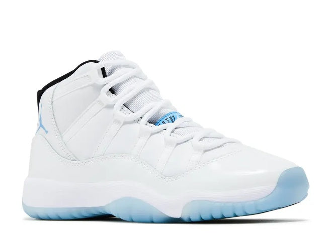 White Air Jordan 11 Kids sneaker, Legend Blue sole & black trim.