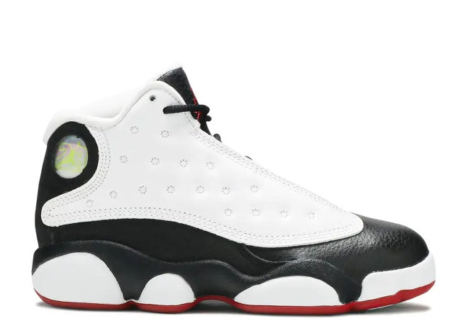 Air Jordan 13 PS kids sneaker in white, black, and red, side profile view.