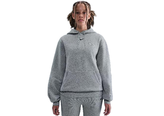 Nike NOCTA Athletic Grey Mens Hoodie. Grey hooded sweatshirt with small black Swoosh, kangaroo pocket.