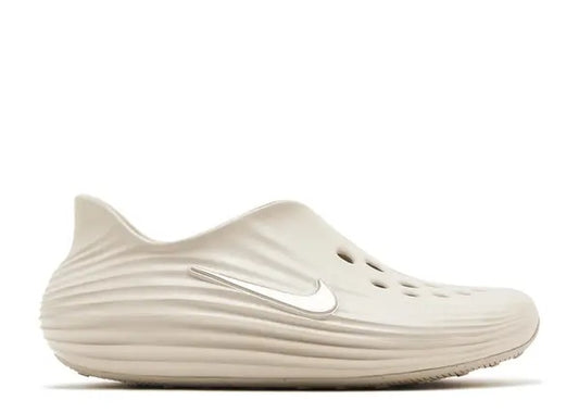 Nike ReactX ReJuen8 mens Orewood Brown slip-on casual shoe, ribbed design, silver swoosh.