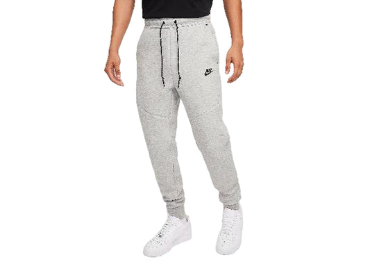 Nike Mens Tech Fleece Pants, Athletic Grey, tapered fit, shown on a man.