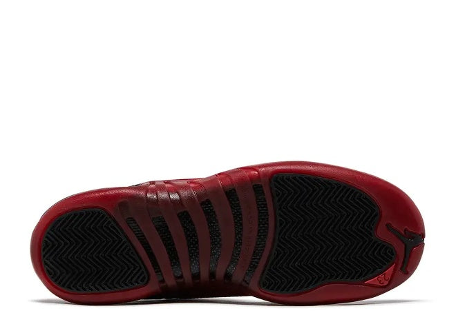 Air Jordan 12 Boys Varsity Red Kids Sneaker sole view with black traction pattern.