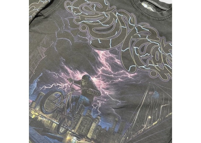Black wash Godspeed BMX LS T-shirt with skeleton biker, purple lightning, and NYC cityscape graphic.