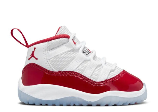 Air Jordan 11 Infants white & varsity red sneaker, side view, with Jumpman logo.