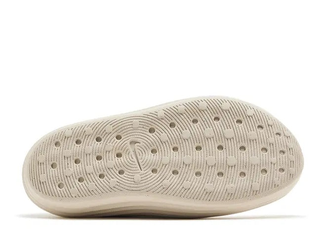 Nike ReactX ReJuen8 mens casual shoe, Orewood Brown outsole with textured grip pattern and Nike swoosh.