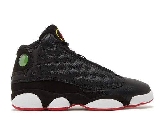 Black Air Jordan 13 GS sneaker with True Red outsole, white pods, and green heel hologram.