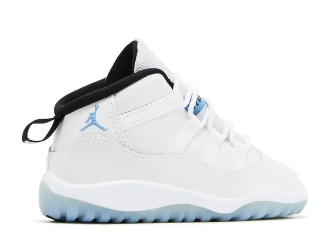 Unisex Air Jordan 11 Infants white, Legend Blue & black sneaker with Jumpman logo & clear blue sole.