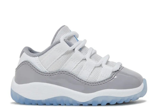 Air Jordan 11 Low Infants white/grey sneaker with University Blue sole.