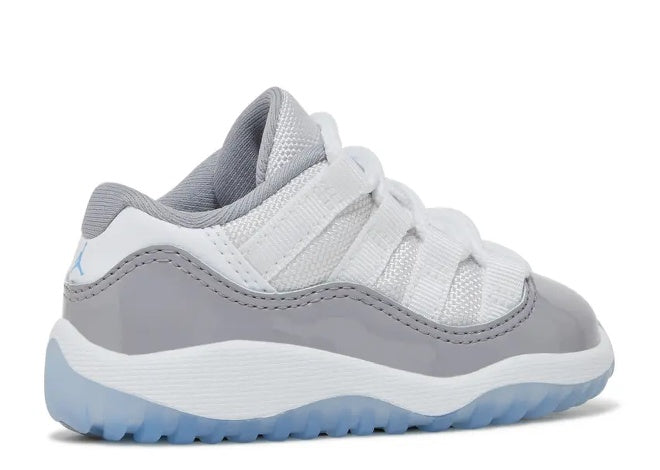 Air Jordan 11 Low Infant sneaker, white, grey, university blue sole. Side view.