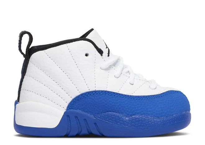 Air Jordan 12 Infants sneaker in white, black, and Game Royal blue.