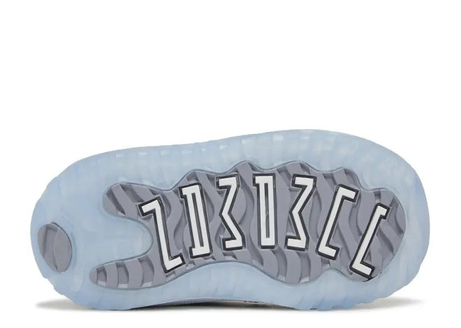 Air Jordan 11 Low Infants sneaker sole: translucent University Blue with grey details and white 11s.