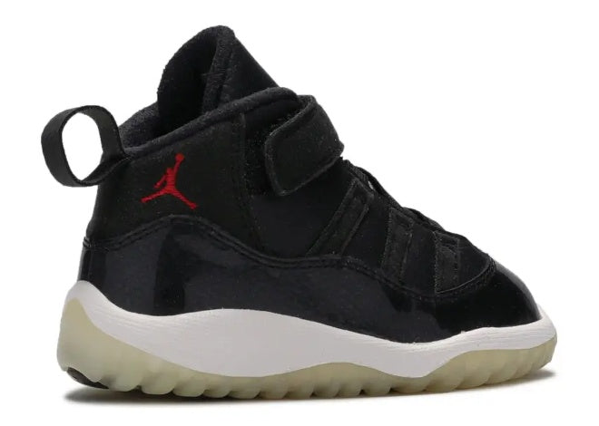 Unisex Air Jordan 11 Infants black patent leather sneaker with red Jumpman, white midsole, Velcro strap.