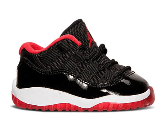 Air Jordan 11 Low Infants black, true red & white sneaker.