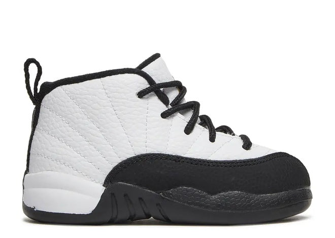 Air Jordan 12 infant sneakers in white and black, perfect for babies.