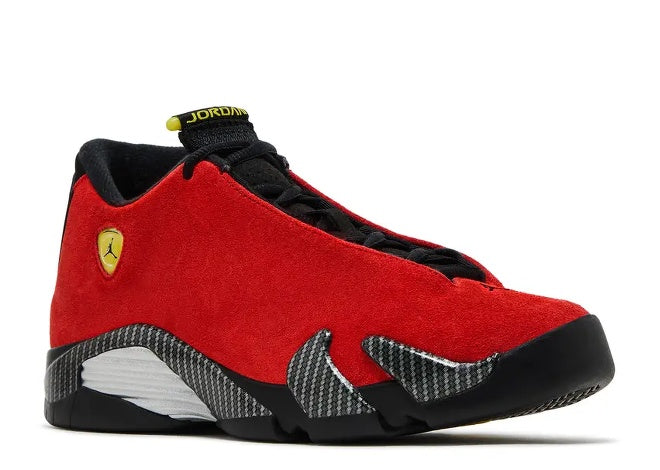 Kids Air Jordan 14 Ferrari sneaker: red suede upper, black midsole, carbon fiber details, yellow logo.