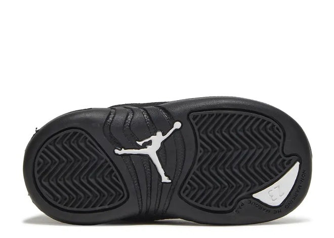Air Jordan 12 Infants black sneaker sole with white Jumpman logo and 23.