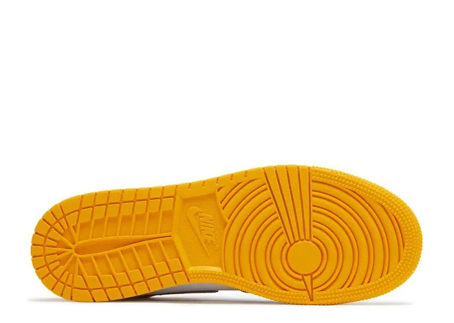 Kids Air Jordan 1 sneaker, university gold outsole with visible Nike logo.