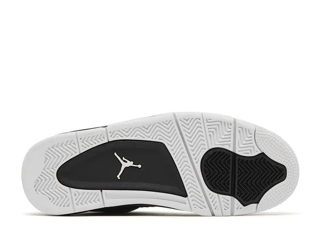 Air Jordan 4 GS Black White kids sneaker outsole with iconic Jumpman logo.