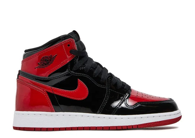 Kids Air Jordan 1 High black, red, white patent leather sneaker.