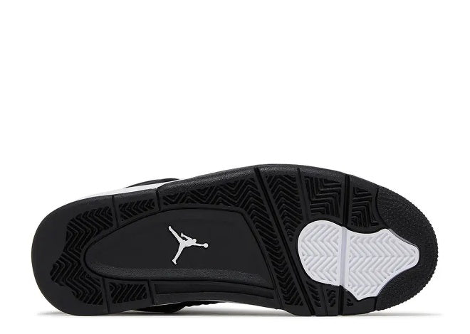 Air Jordan 4 GS Black White (FQ8213-001) sneaker sole with white Jumpman logo and grip pattern.