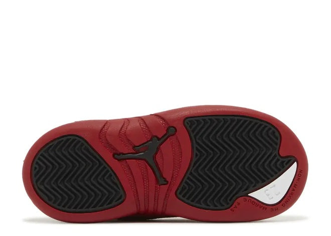 Air Jordan 12 Infants Varsity Red Black sneaker bottom sole with Jumpman logo and 23 detail.