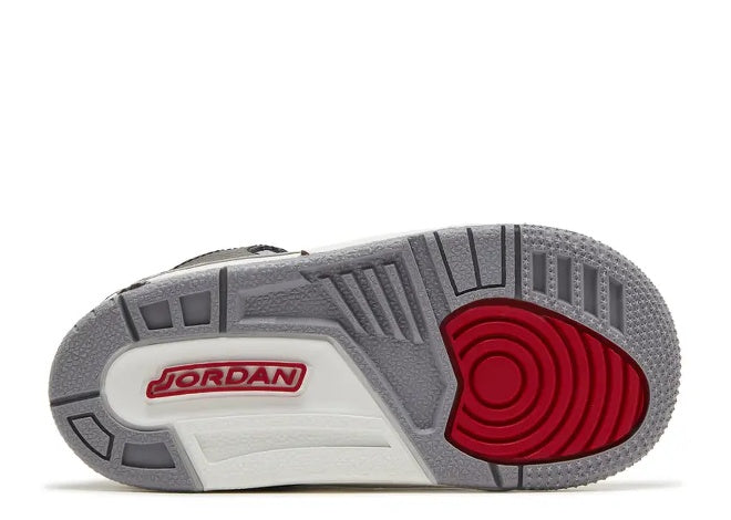 Air Jordan 3 TD toddler sneaker sole: black, fire red, cement grey, white, with JORDAN logo.