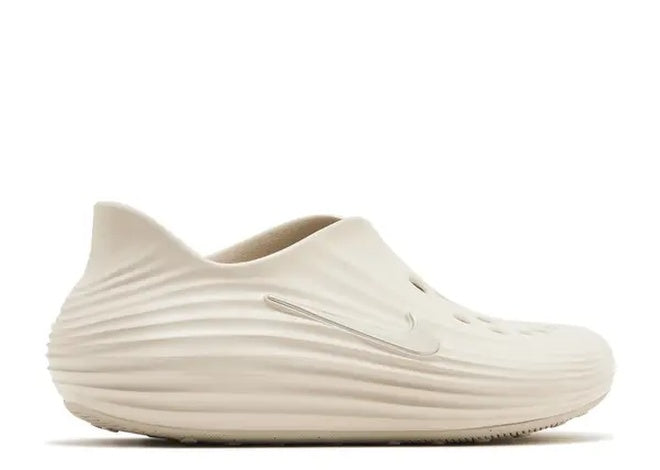 Nike ReactX ReJuen8 Mens casual shoe, Orewood Brown, slip-on, wavy textured upper, subtle swoosh.
