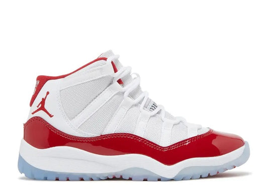 Air Jordan 11 PS white & red kids sneaker with Jumpman logo and patent leather.